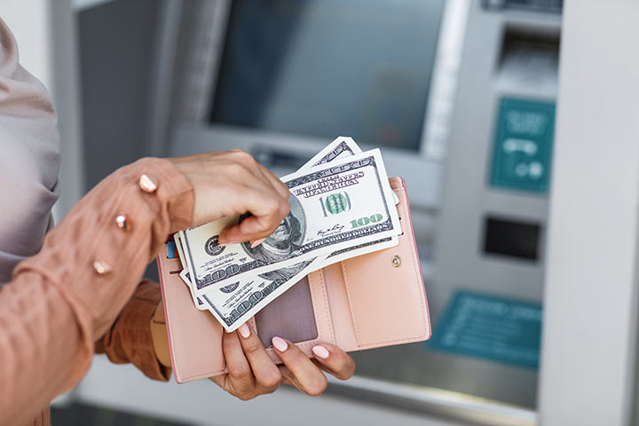 A Filipina woman withdrawing money