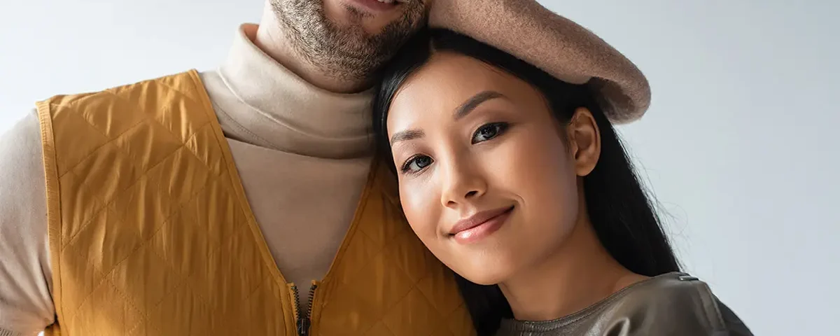 A close-up portrait of a Filipina woman and her foreign partner, representing a serious international relationship built on mutual respect and aligned family goals.