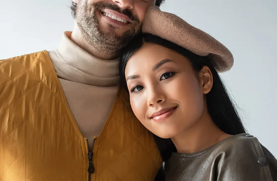 A close-up portrait of a Filipina woman and her foreign partner, representing a serious international relationship built on mutual respect and aligned family goals.