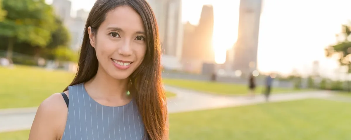 Filipina woman with confident expression in urban setting, representing modern Filipina marriage culture