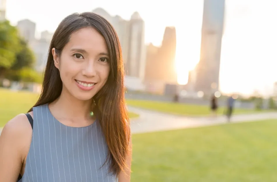 Filipina woman with confident expression in urban setting, representing modern Filipina marriage culture