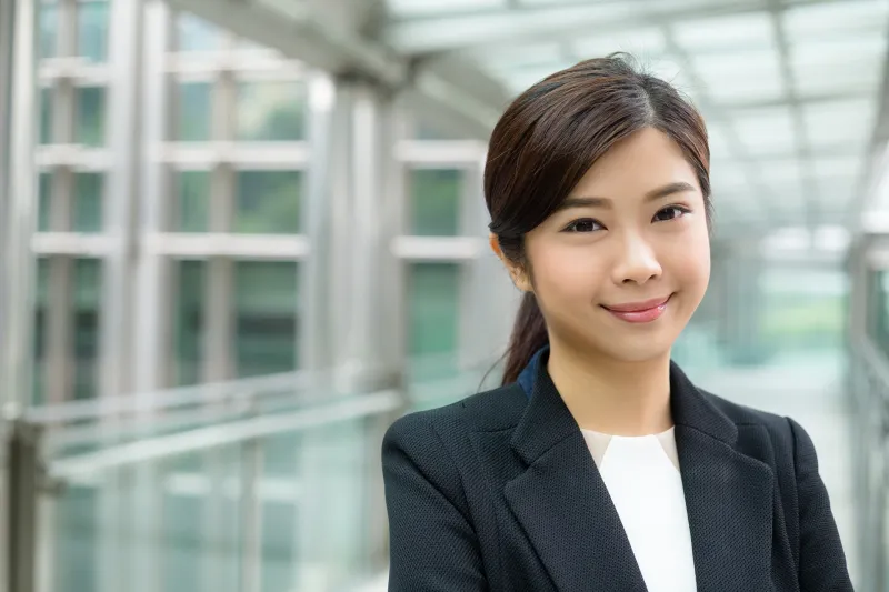 Professional woman in modern office, reflecting reliability and practical life partnership values