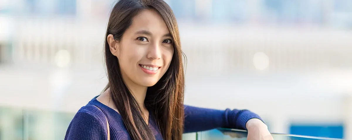 Smiling Filipina standing outdoors