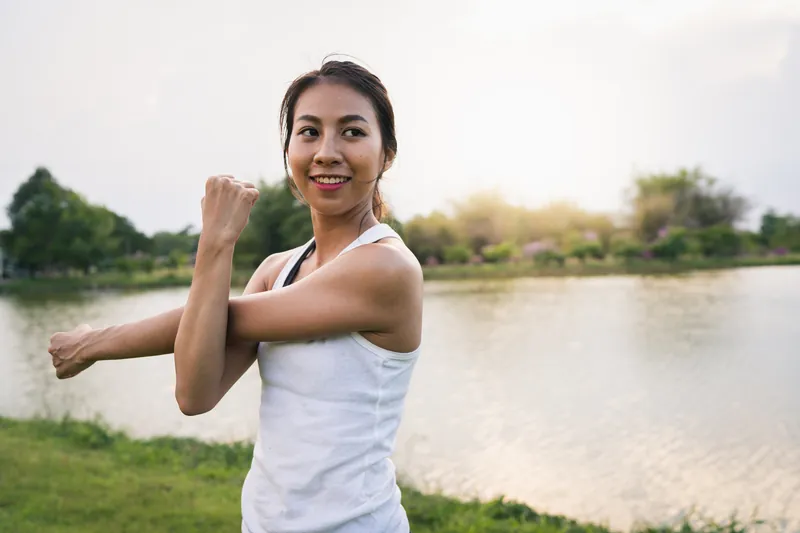 Woman in tropical outdoor setting showing genuine energy and confidence during in-person Filipina chat transition