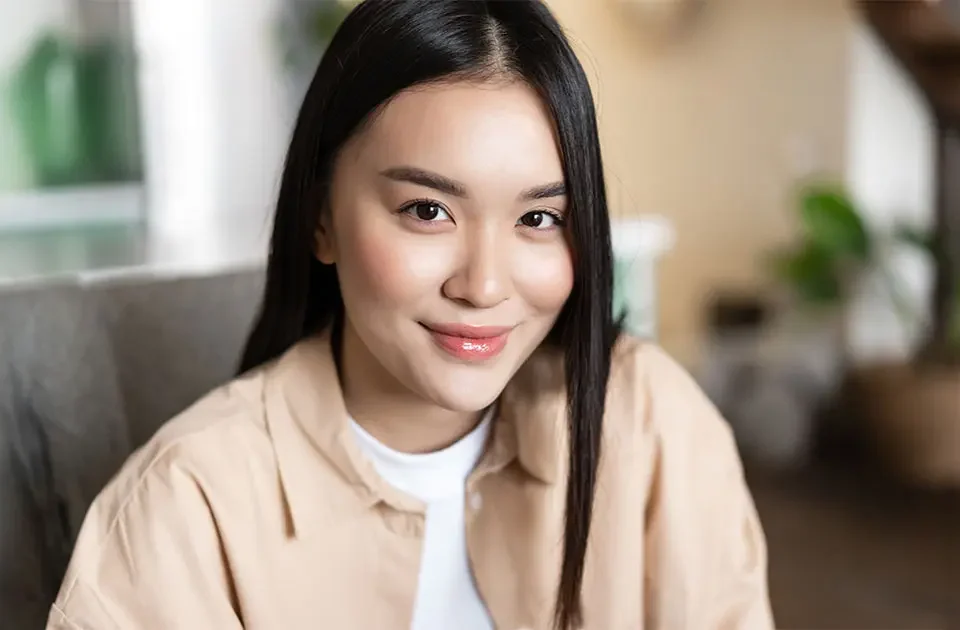 Close-up of Filipina woman smiling for online dating profile photo