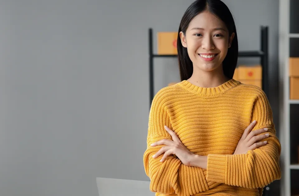 Woman confidently managing online business from her laptop
