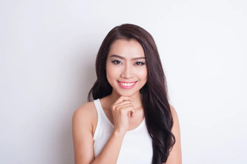 Thoughtful Filipina wife portrait expressing confidence and genuine interest