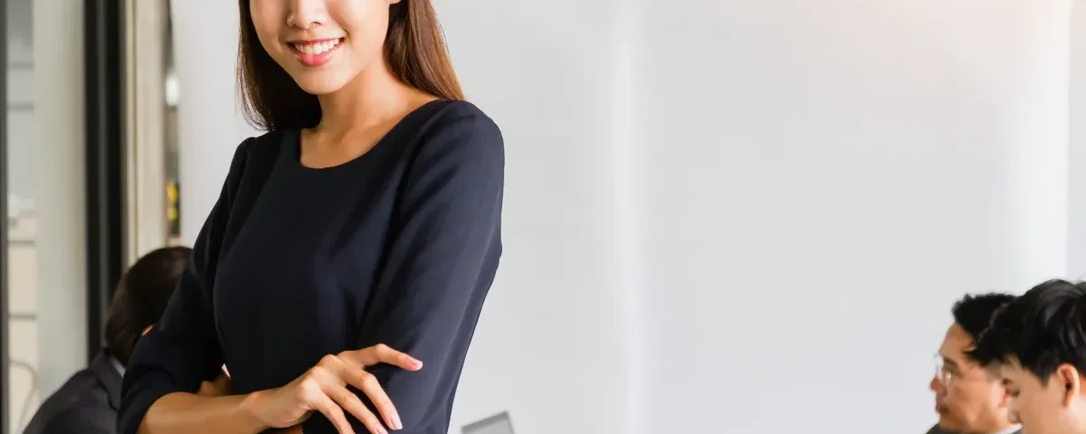 Asian businesswoman smiling with warm confidence and composure