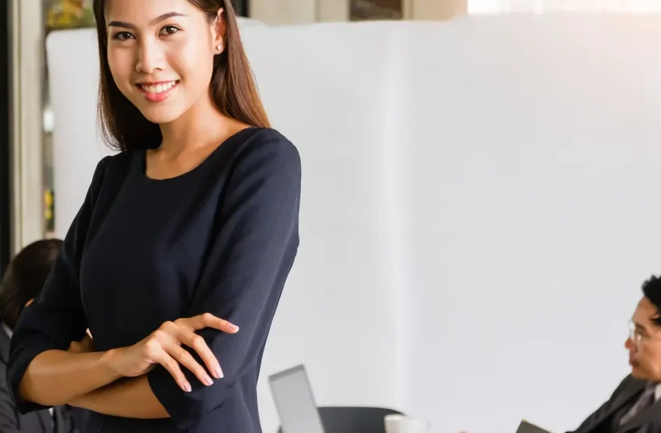 Asian businesswoman smiling with warm confidence and composure