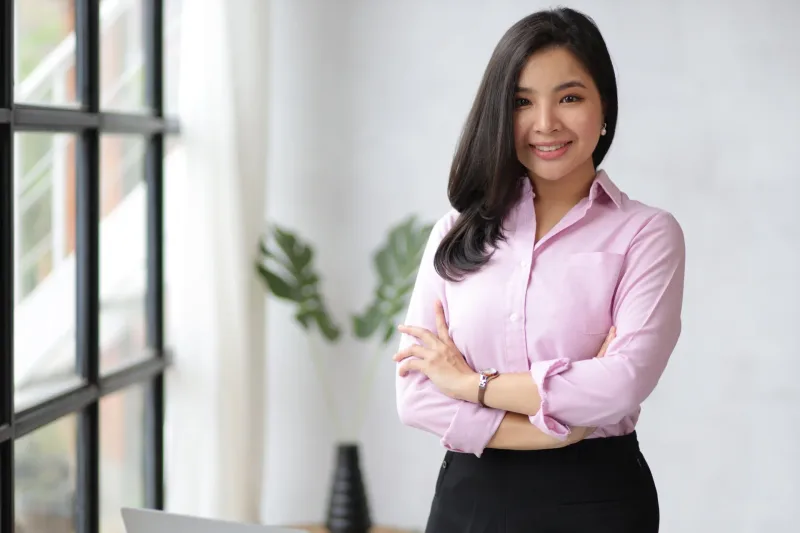 Professional Asian woman with confident, composed demeanor