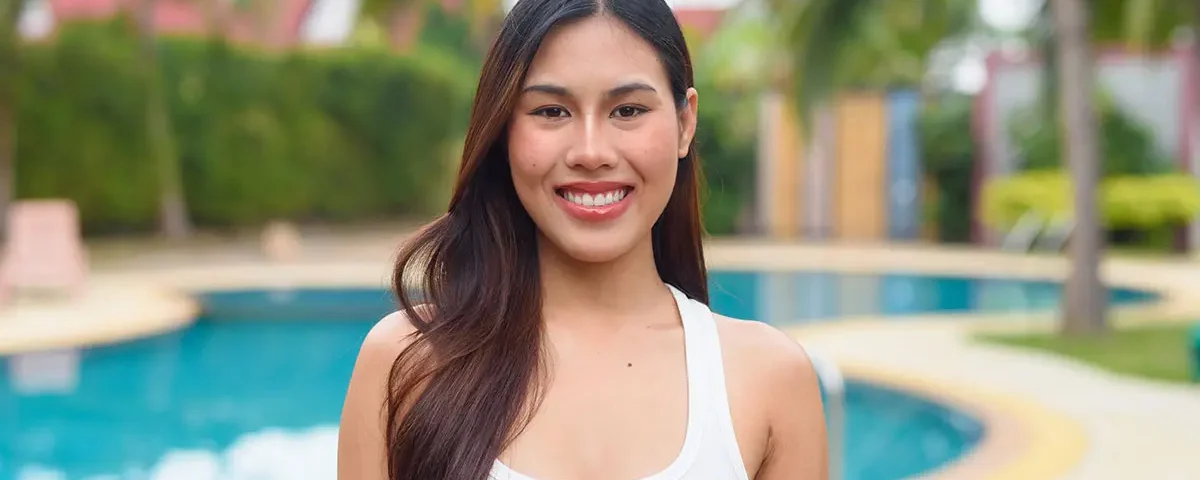 Smiling Filipina by a big pool