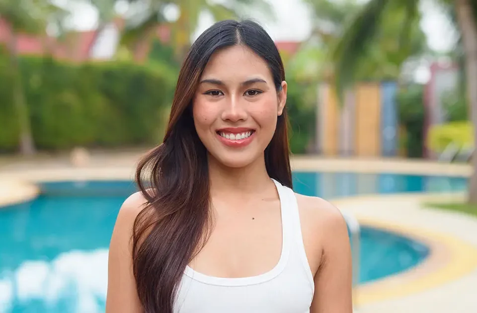 Smiling Filipina by a big pool