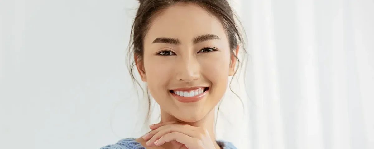 Woman smiling confidently in professional headshot