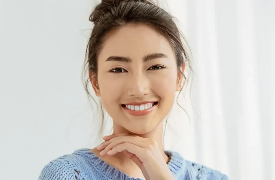 Woman smiling confidently in professional headshot
