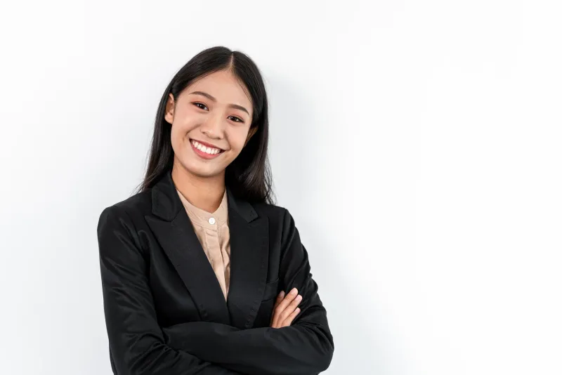 Professional woman in dark business jacket with confident pose