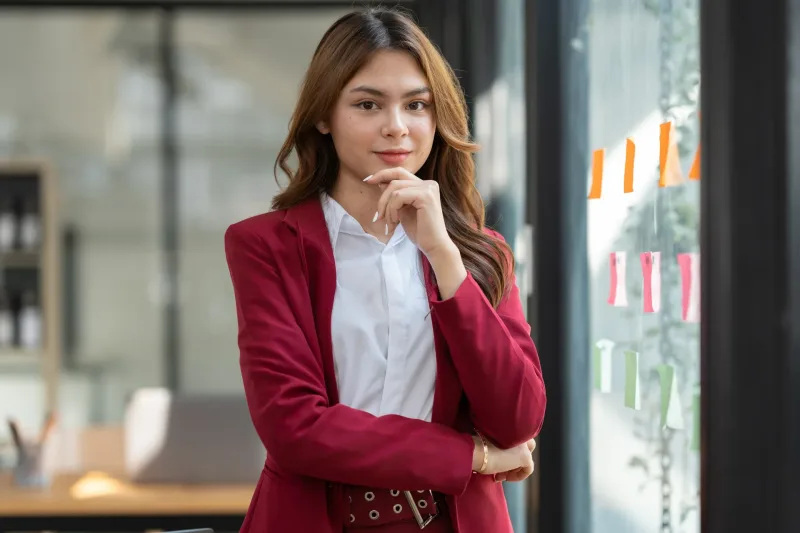 Thoughtful professional woman in office, conveying intention and clarity