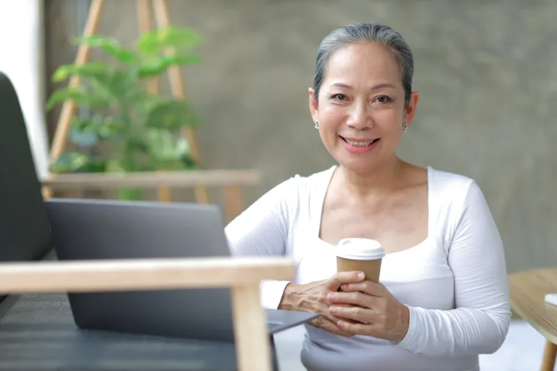 Woman relaxing at home with coffee, reflecting family comfort and acceptance
