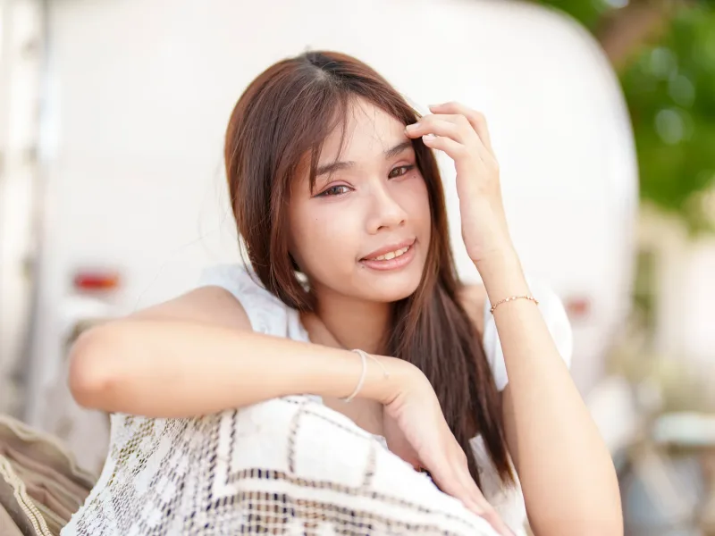 Woman relaxing outdoors in comfortable outdoor seating