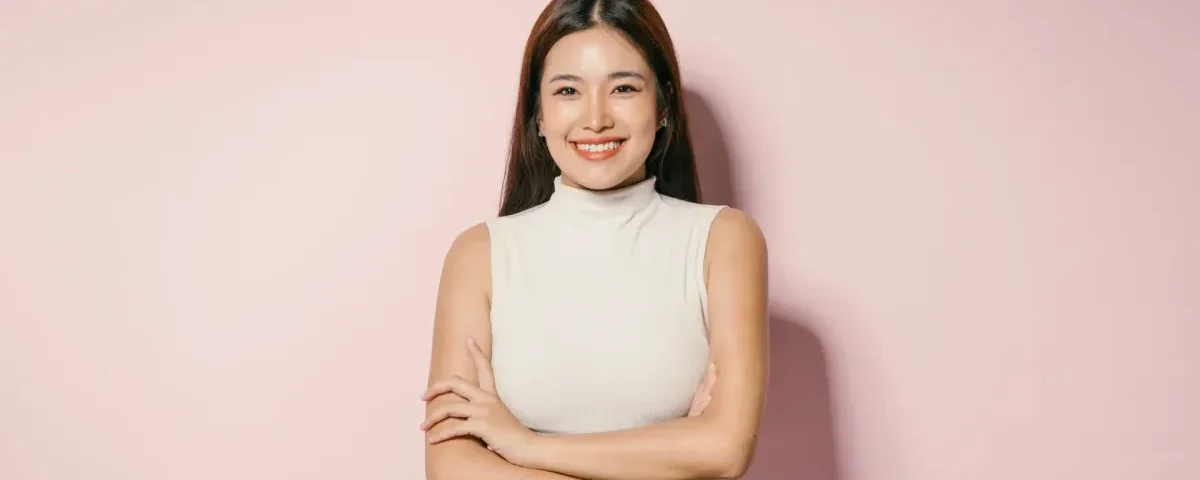 Woman with confident smile wearing professional attire