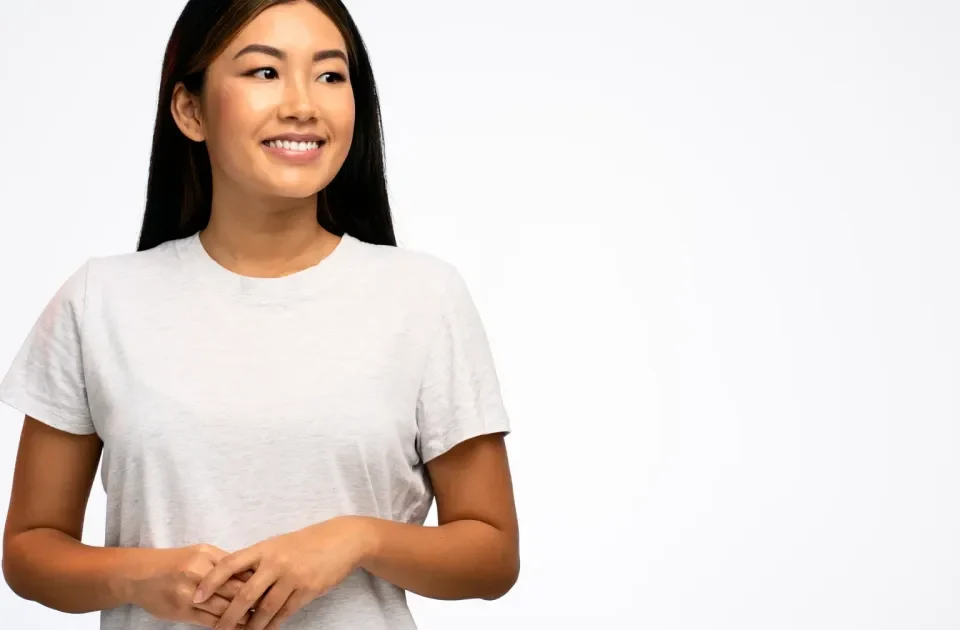 Confident woman with a warm, thoughtful expression in natural light