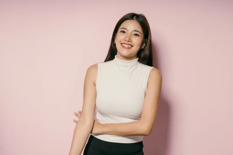 Woman confident portrait against pink background