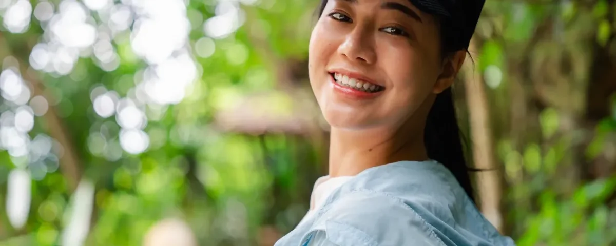 Woman smiling confidently in professional portrait setting