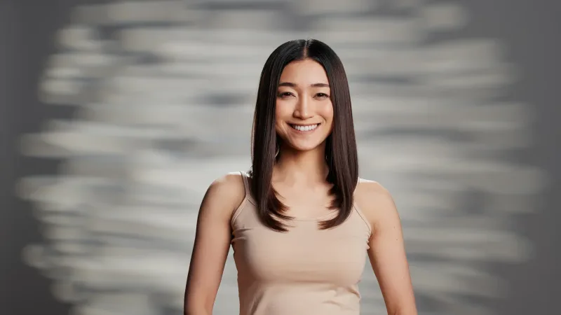 Professional headshot of a woman with a confident, composed expression