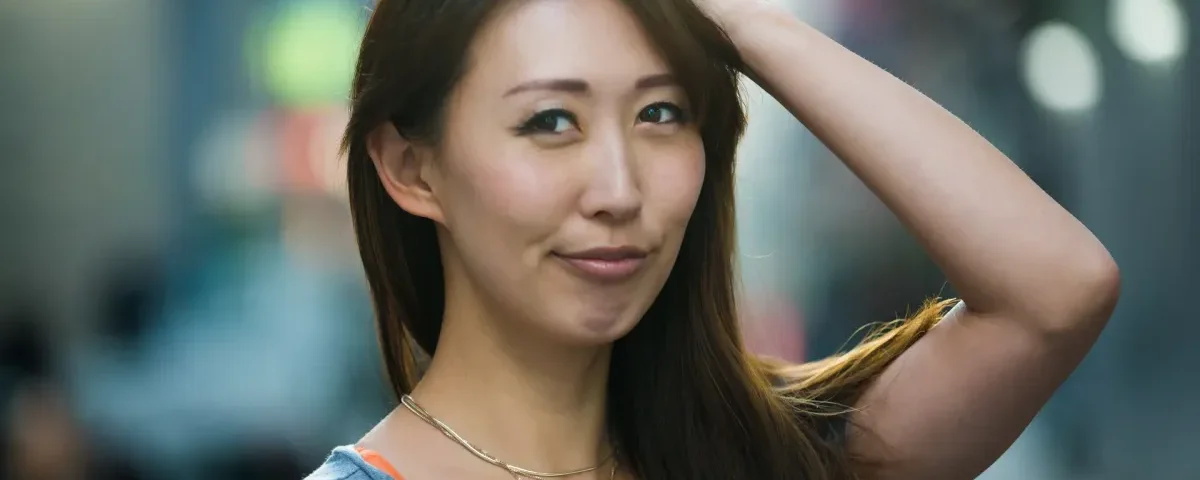Woman smiling confidently with warm, approachable expression
