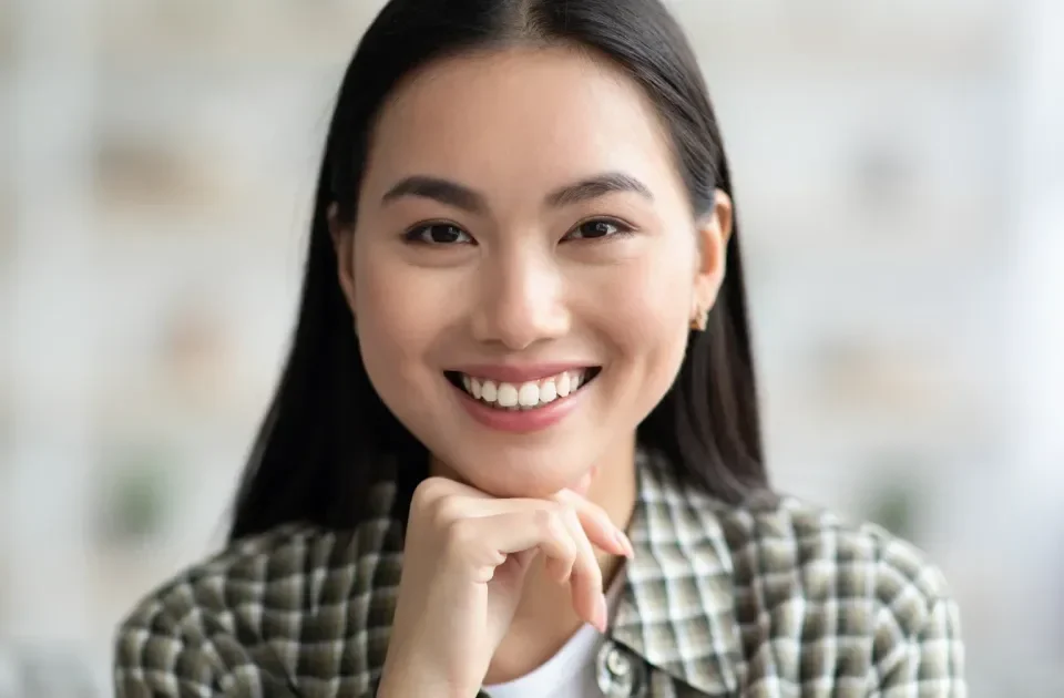 Woman with confident, warm smile ready for conversation