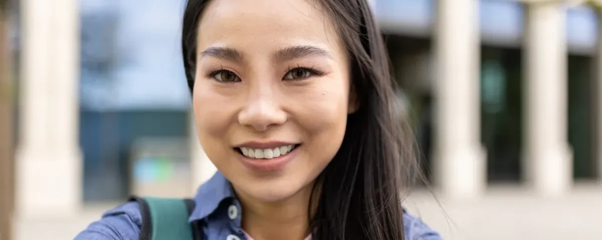 Woman smiling confidently in professional portrait setting