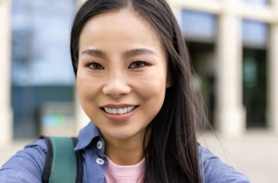 Woman smiling confidently in professional portrait setting