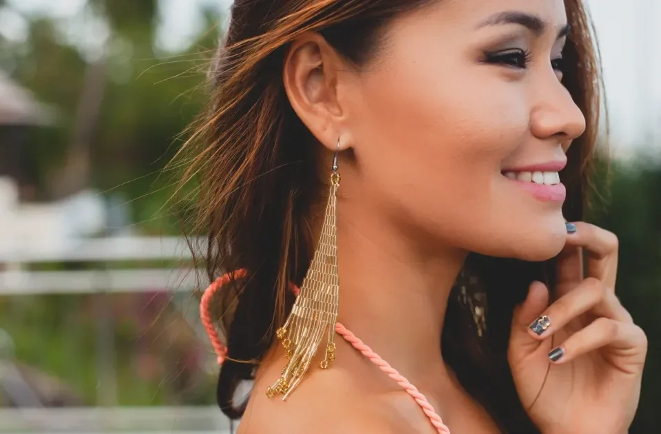 Woman smiling confidently, representing warmth and approachability when meeting family.