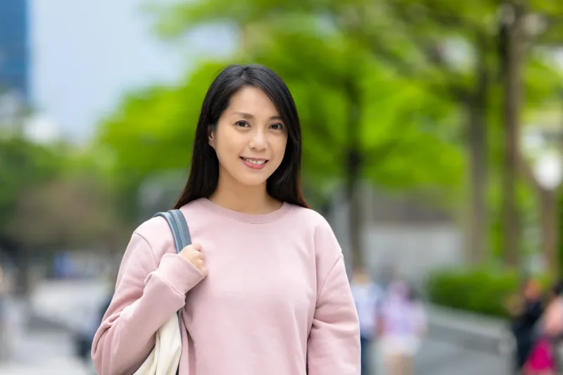 Young woman smiling in casual outdoor portrait