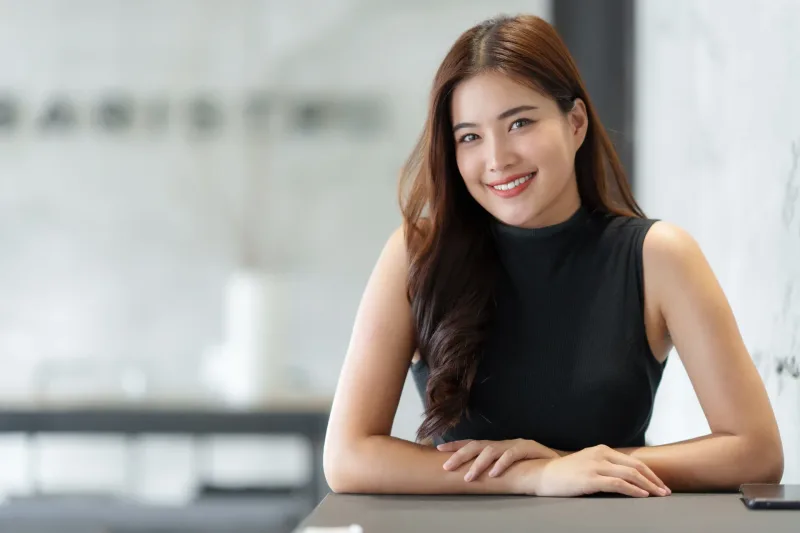 Professional woman smiling in modern indoor environment