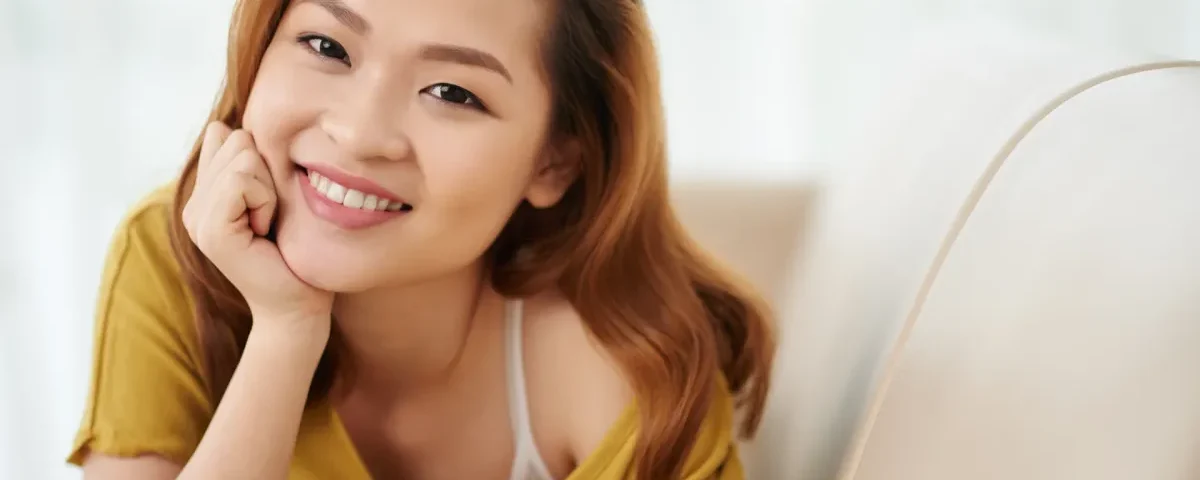 Professional woman smiling confidently in modern office environment
