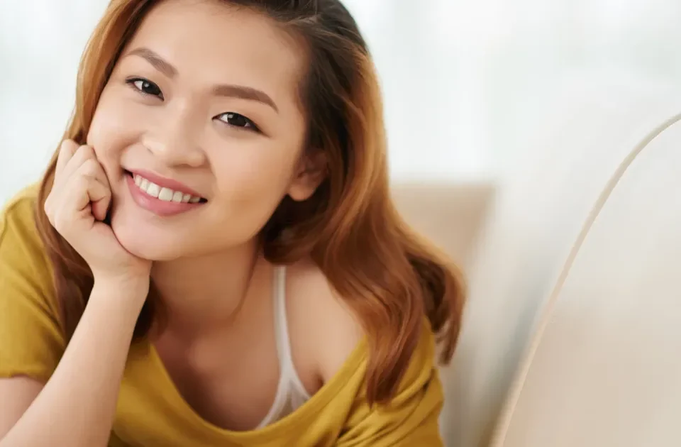 Professional woman smiling confidently in modern office environment